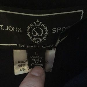 Stunning black jean jacket with sequined American Flag on back.